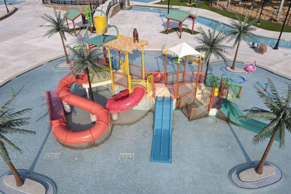 Ariel view of kiddie pool area with colorful slides and play area