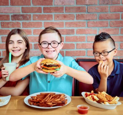 three kids with food